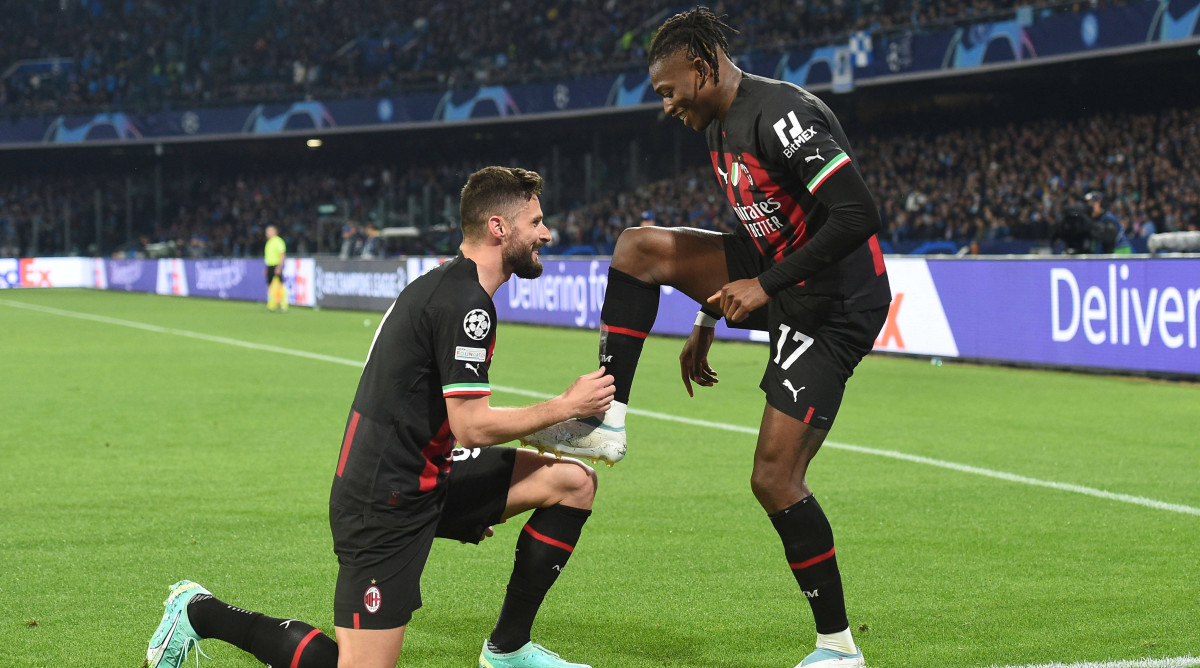 Rafael Leao and Olivier Giroud celebrate a goal.